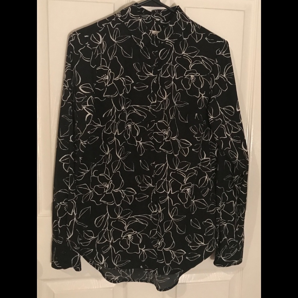 White outlines roses on black blouse